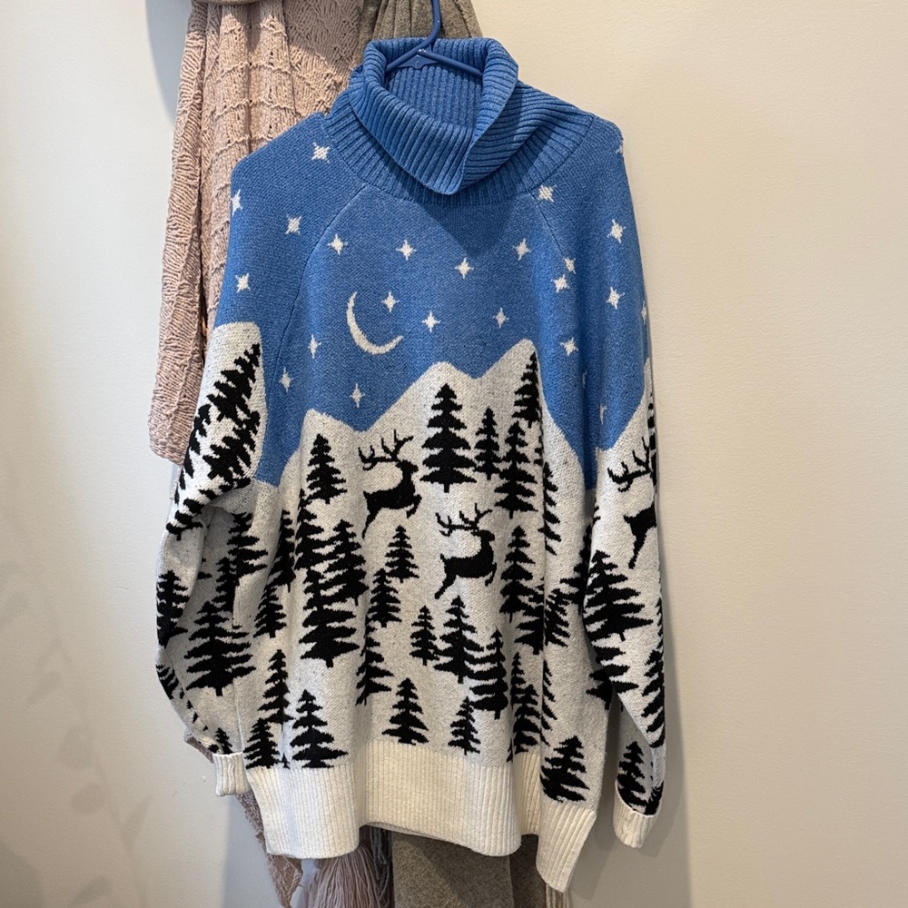 Blue Turtleneck Sweater with Reindeer Design